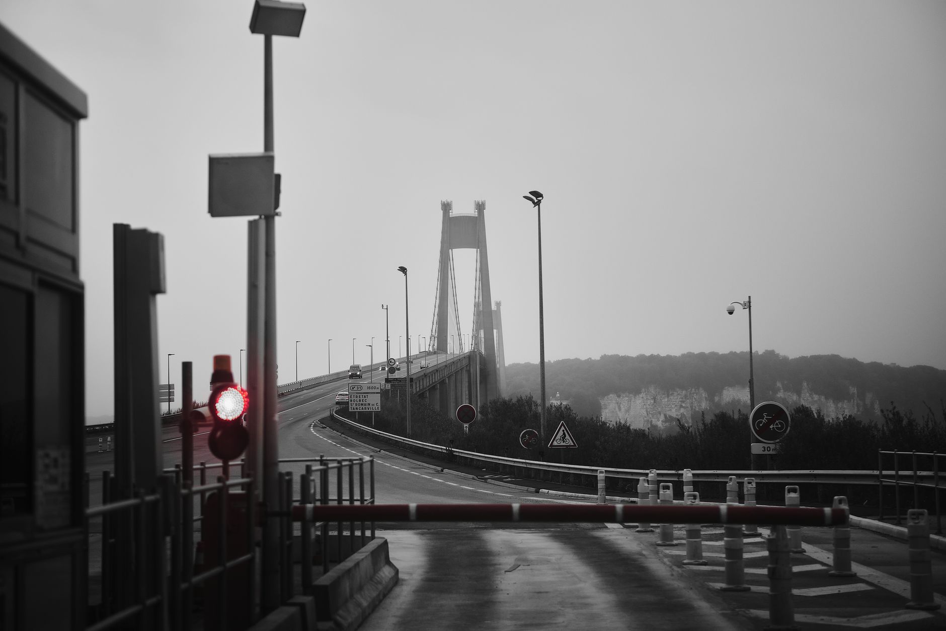Cars passing through toll booths on a modern highway concession road