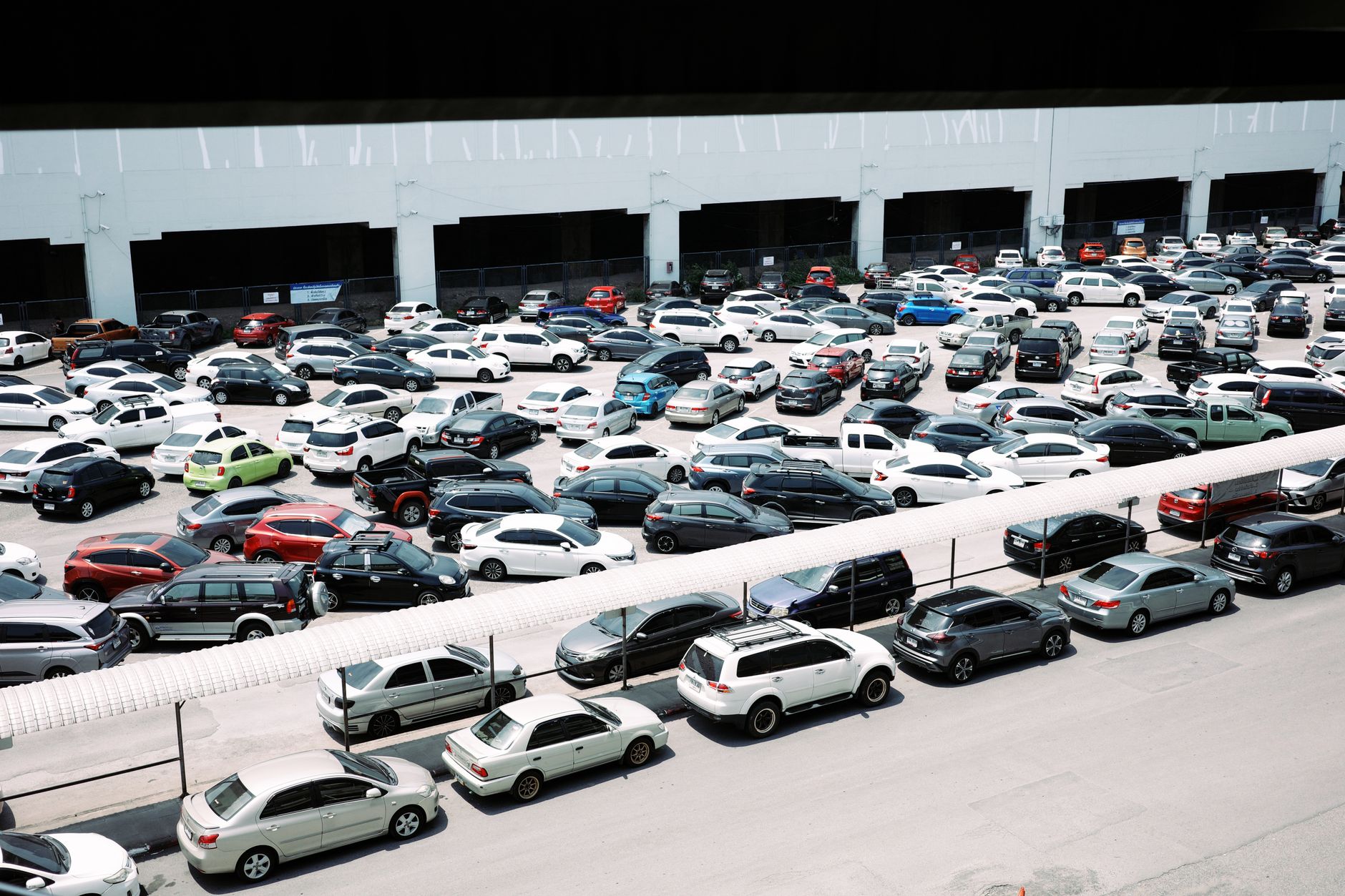 Vehicles lined up at a wholesale car auction representing fleet disposal and residual value risk