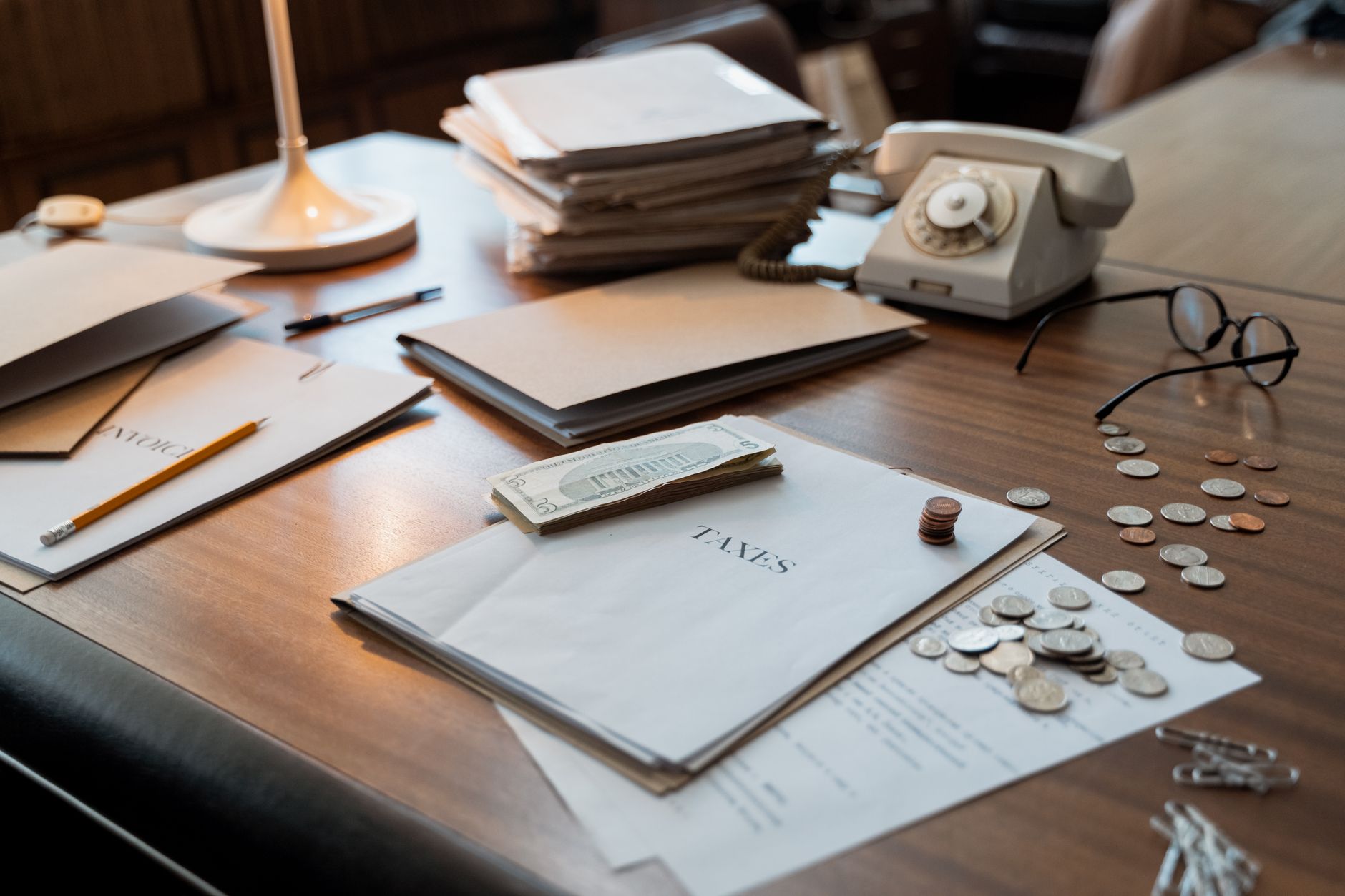 Financial and legal documents on a desk representing tax credit transaction due diligence