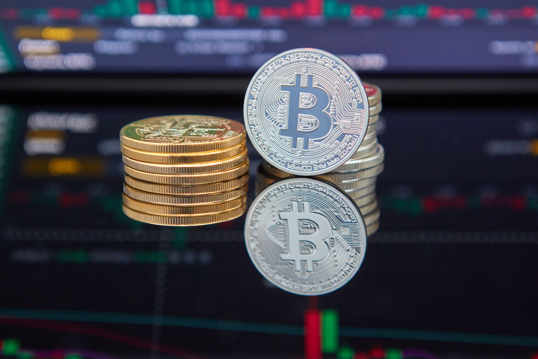 Trader reviewing bond market data on computer screens
