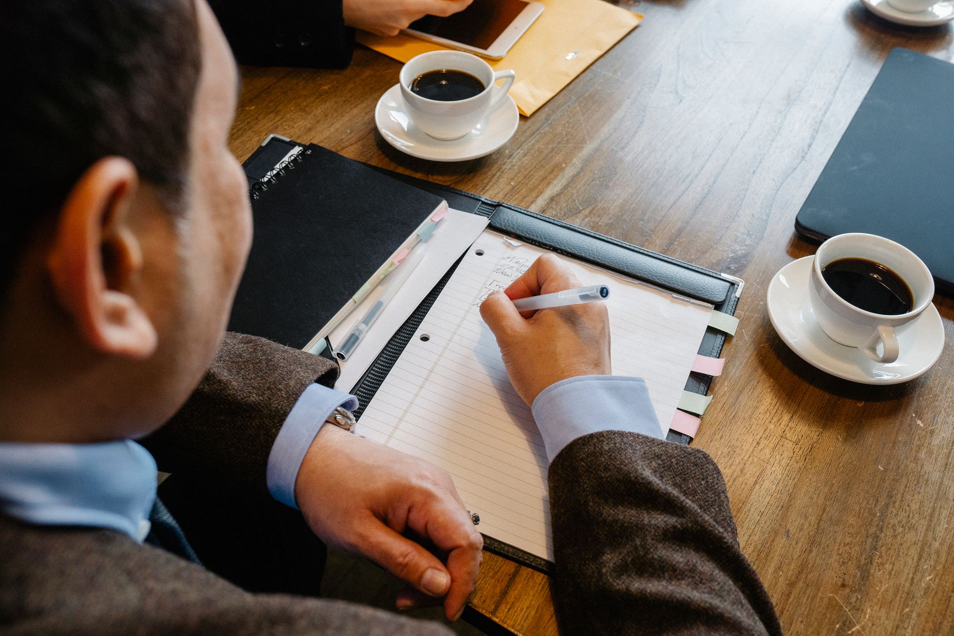Family office advisors discussing investment strategy around a conference table