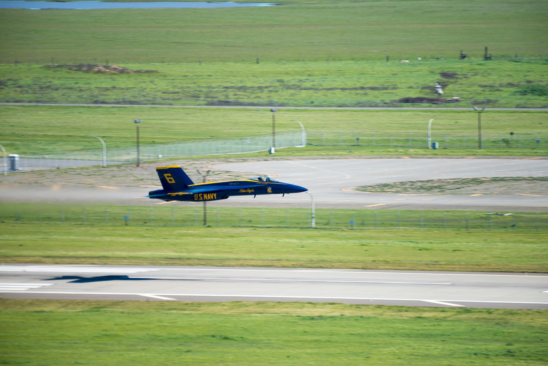 Private aircraft parked on airport runway viewed from above