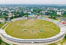 Aerial view of a large sports stadium, representing venue infrastructure and debt financing