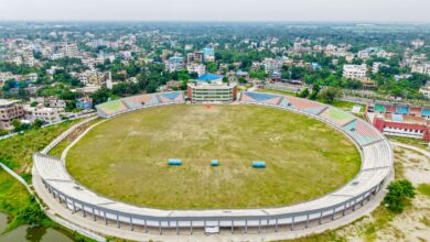 Aerial view of a large sports stadium, representing venue infrastructure and debt financing