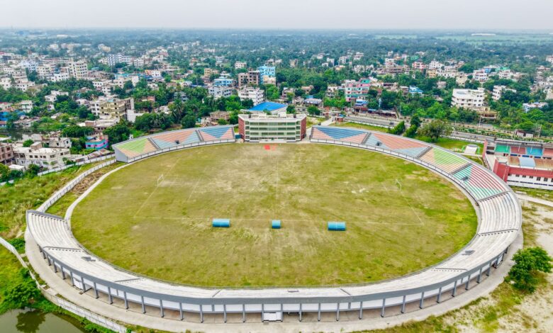 Aerial view of a large sports stadium, representing venue infrastructure and debt financing