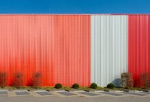 Exterior view of a large data center facility with power infrastructure
