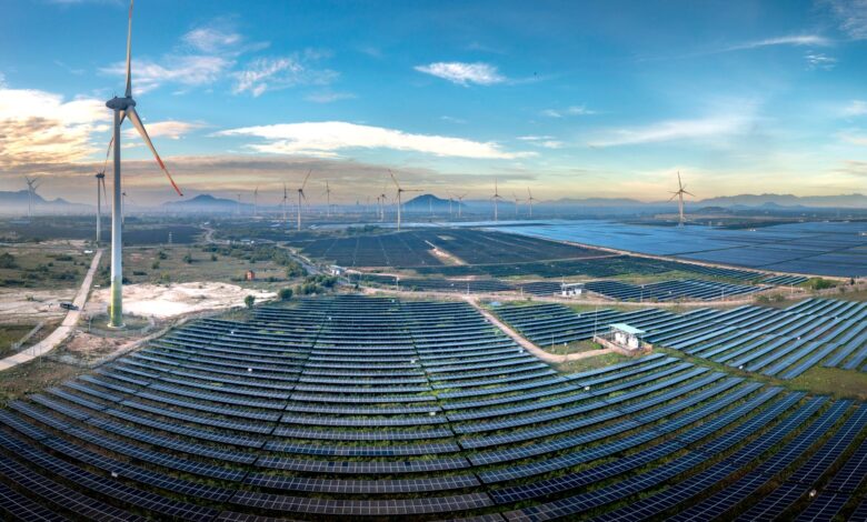 Aerial view of a large utility-scale solar farm on open land