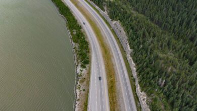 Aerial view of a multi-lane toll highway stretching through open landscape