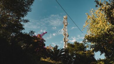 Cell tower against blue sky representing wireless infrastructure easement investments