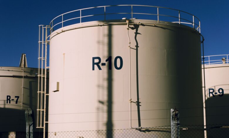 Large crude oil storage tanks at an industrial terminal facility