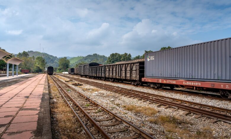 Aerial view of a freight rail terminal with intermodal containers and rail lines