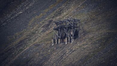 Open pit uranium mine with industrial equipment and exposed ore deposits