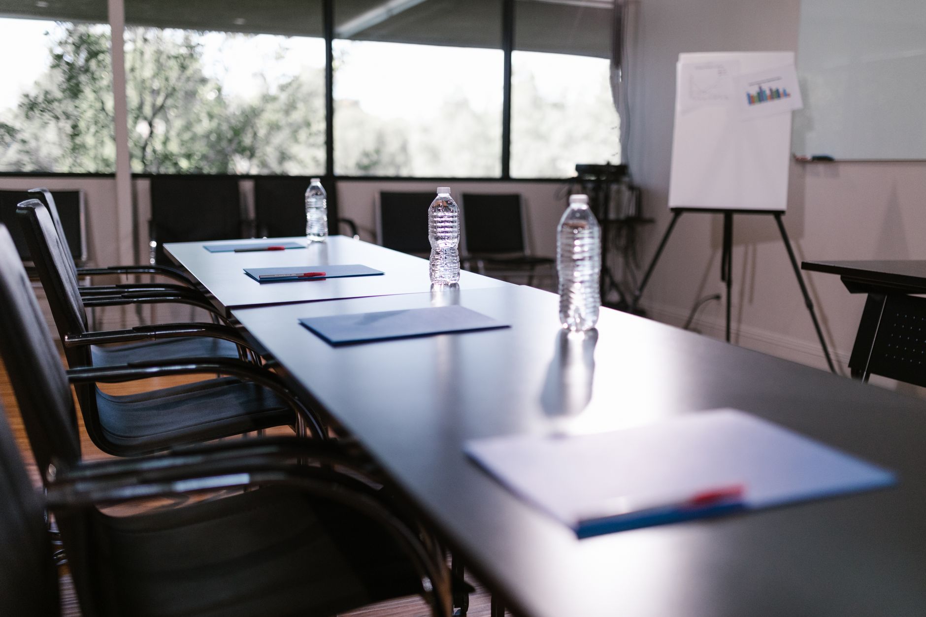 Business professionals meeting in a boardroom to discuss private investment strategy