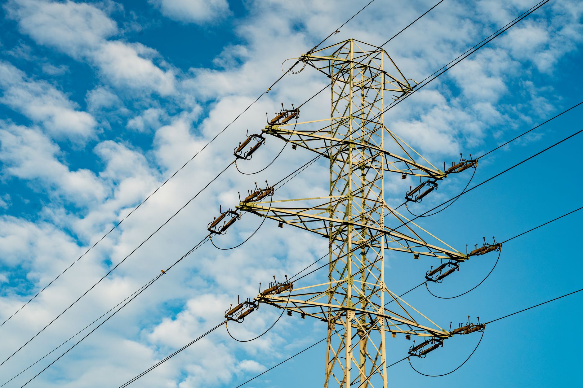 High-voltage electrical transmission towers crossing rural land