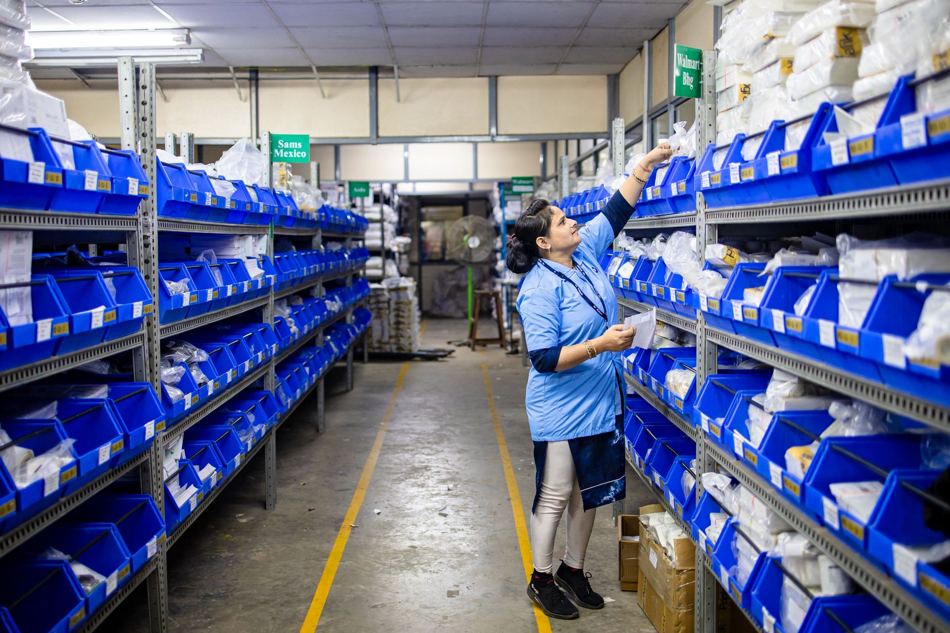 Interior of a large logistics warehouse with organized freight and shelving