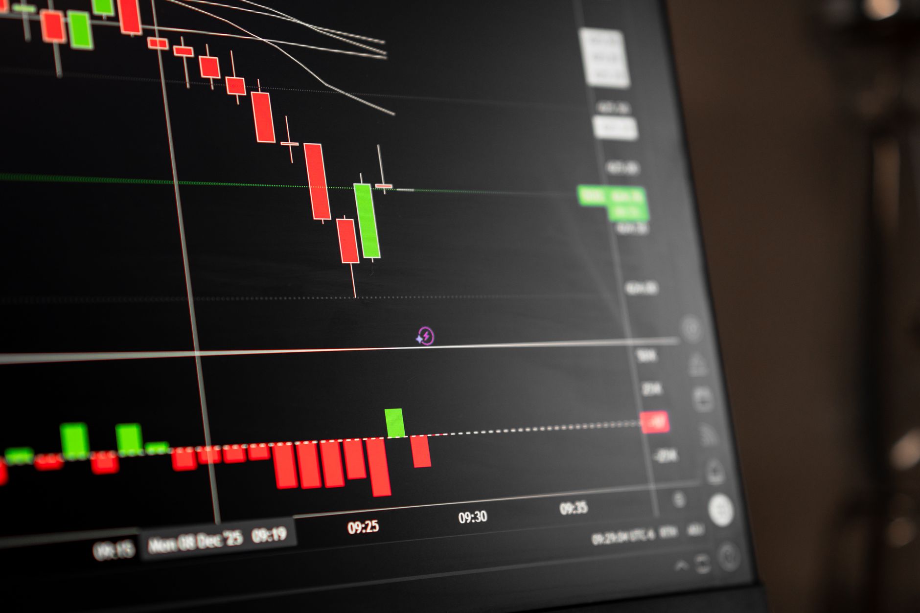 Financial traders reviewing bond market data on multiple computer screens
