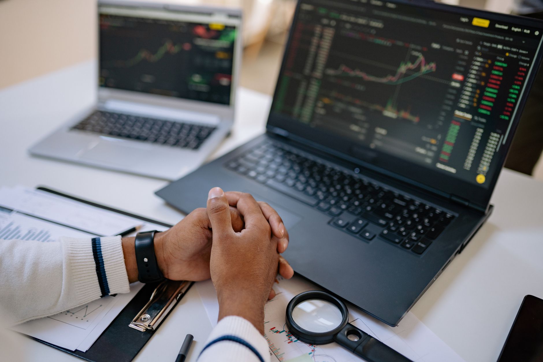 Financial trading desk with monitors displaying bond market data