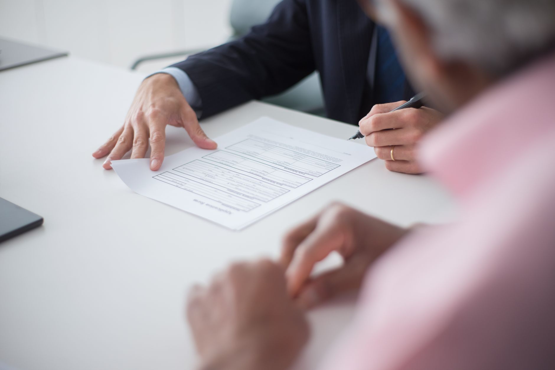 Legal documents and contracts spread across a desk during property review