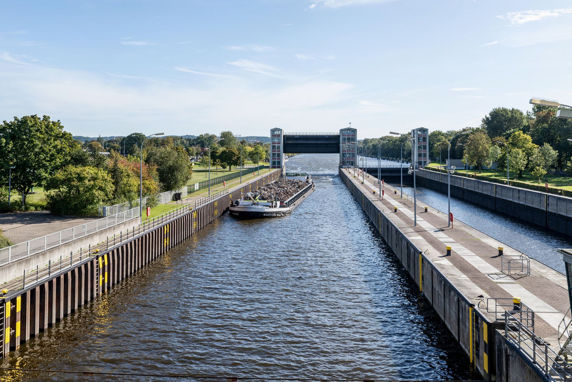 Commercial cargo barge navigating an inland waterway system