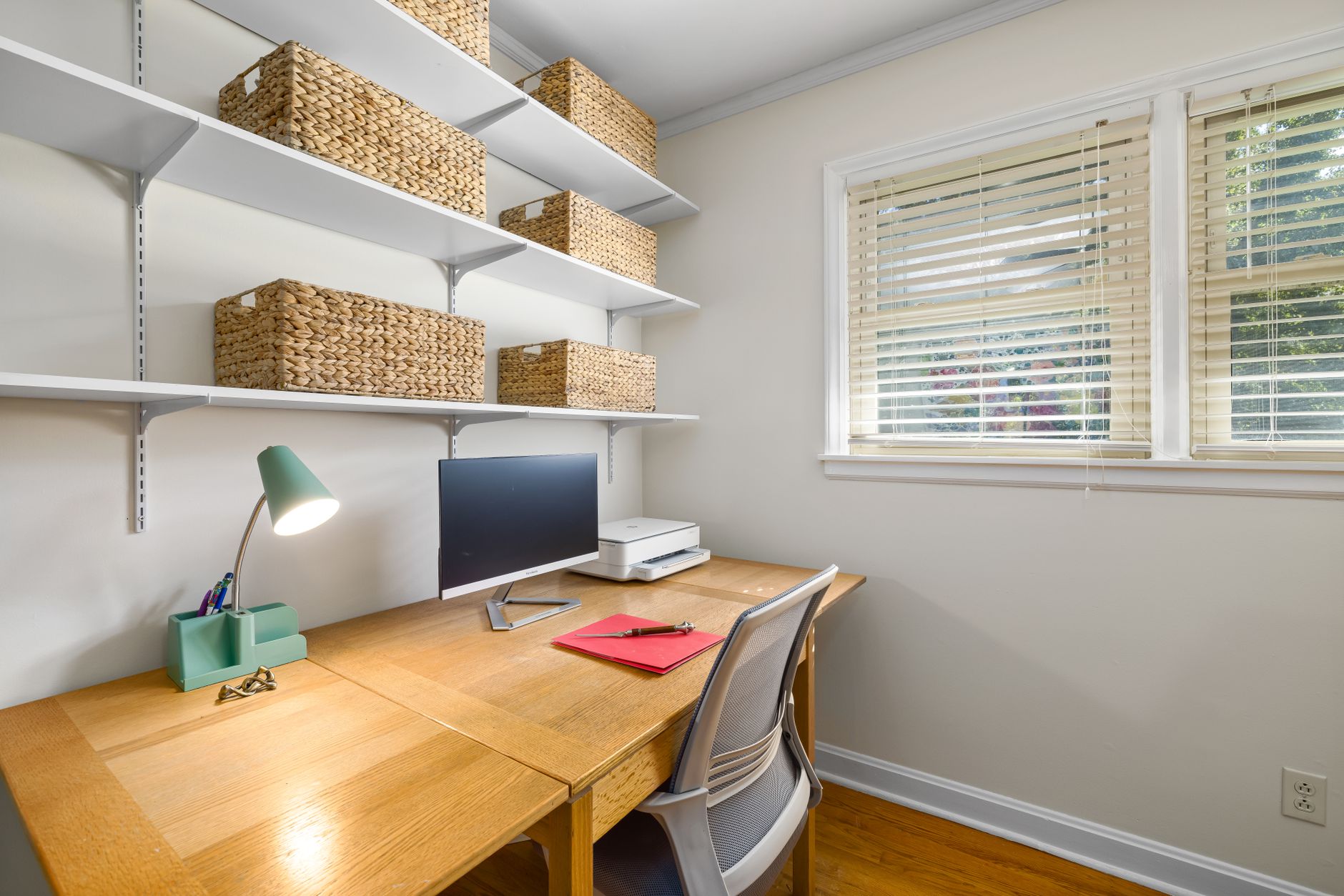 Executive reviewing investment documents at a private office desk, representing family office capital allocation