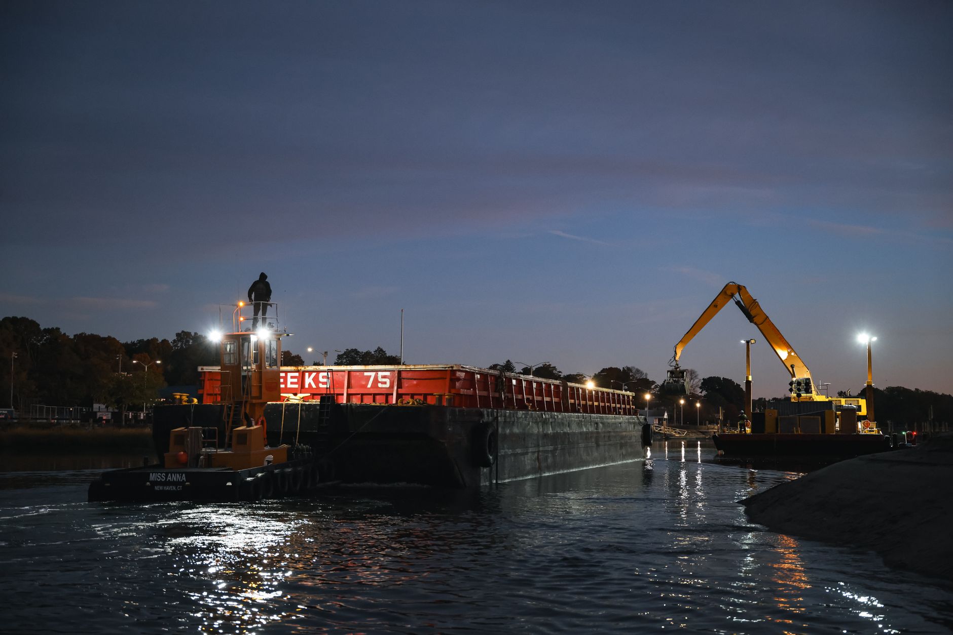 Industrial dredging vessel working in a commercial shipping channel