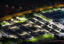 Aerial view of a water treatment facility with circular filtration tanks