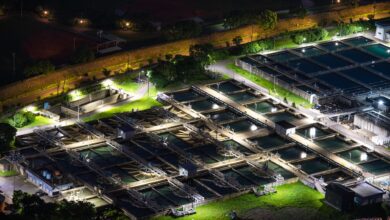 Aerial view of a water treatment facility with circular filtration tanks