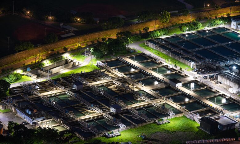 Aerial view of a water treatment facility with circular filtration tanks