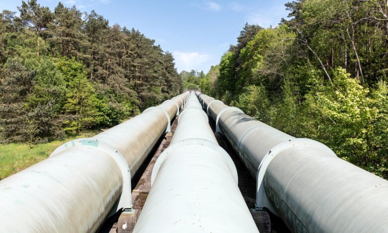 Underground carbon pipeline infrastructure running through flat agricultural land