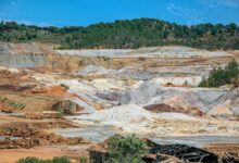 Open pit copper mine showing large scale excavation operations