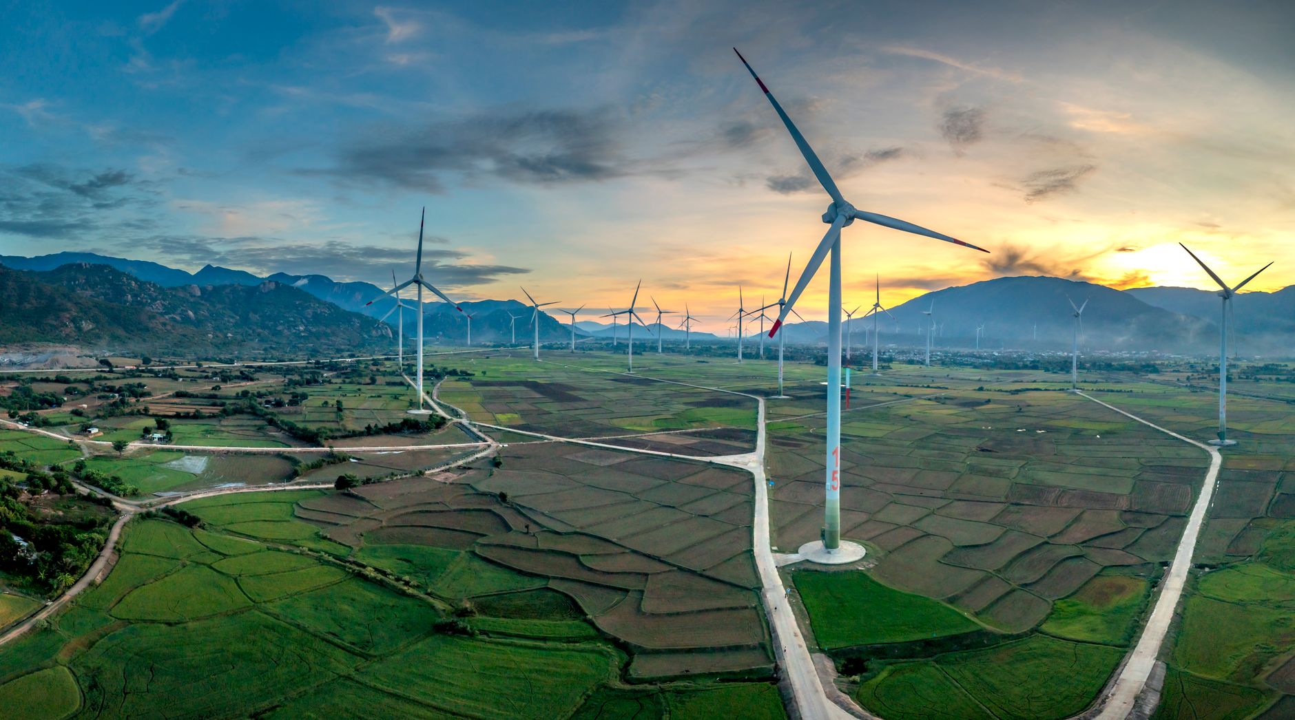 Aerial view of wind turbines on open farmland representing wind farm easement investments