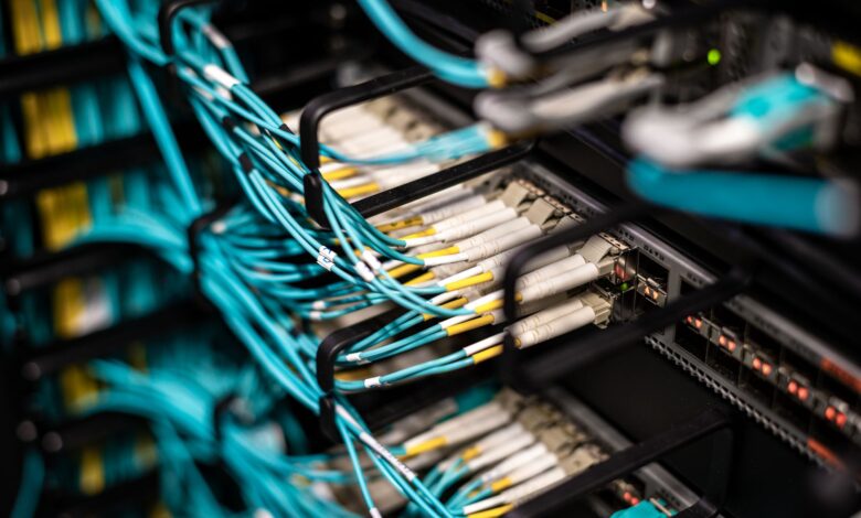 Close-up of fiber optic cables bundled together representing underground conduit infrastructure