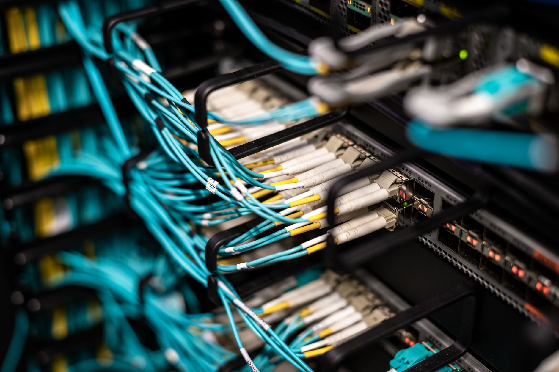 Close-up of fiber optic cables bundled together representing underground conduit infrastructure