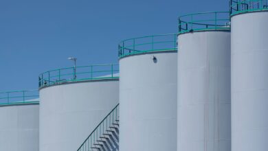 Large crude oil storage tanks at an industrial marine terminal facility