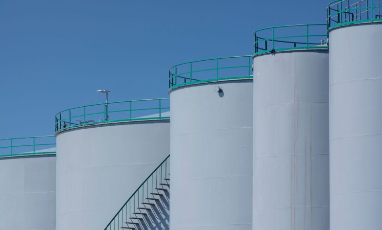 Large crude oil storage tanks at an industrial marine terminal facility