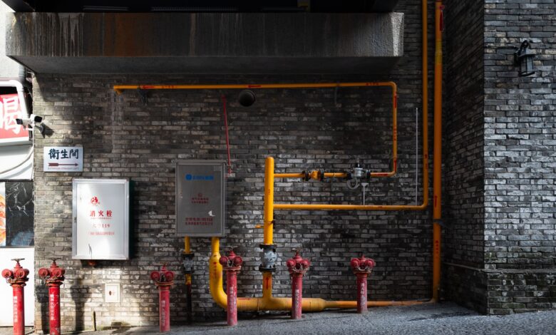 Industrial gas pipeline infrastructure in a rural landscape representing methane capture operations