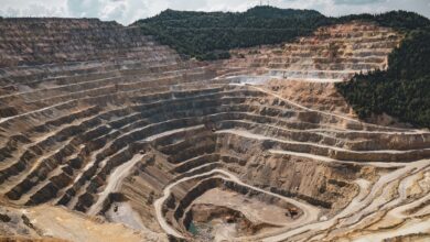 Aerial view of a large potash mining operation with excavation equipment and mineral deposits