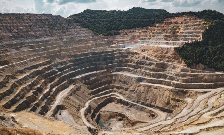 Aerial view of a large potash mining operation with excavation equipment and mineral deposits