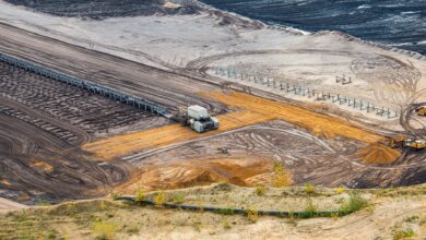 Aerial view of an open-pit mining operation showing excavation and processing equipment