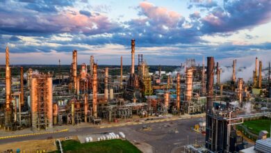 Aerial view of oil extraction infrastructure in an open field representing mineral royalty assets