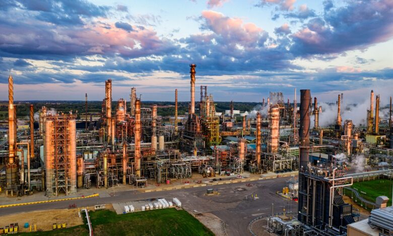 Aerial view of oil extraction infrastructure in an open field representing mineral royalty assets