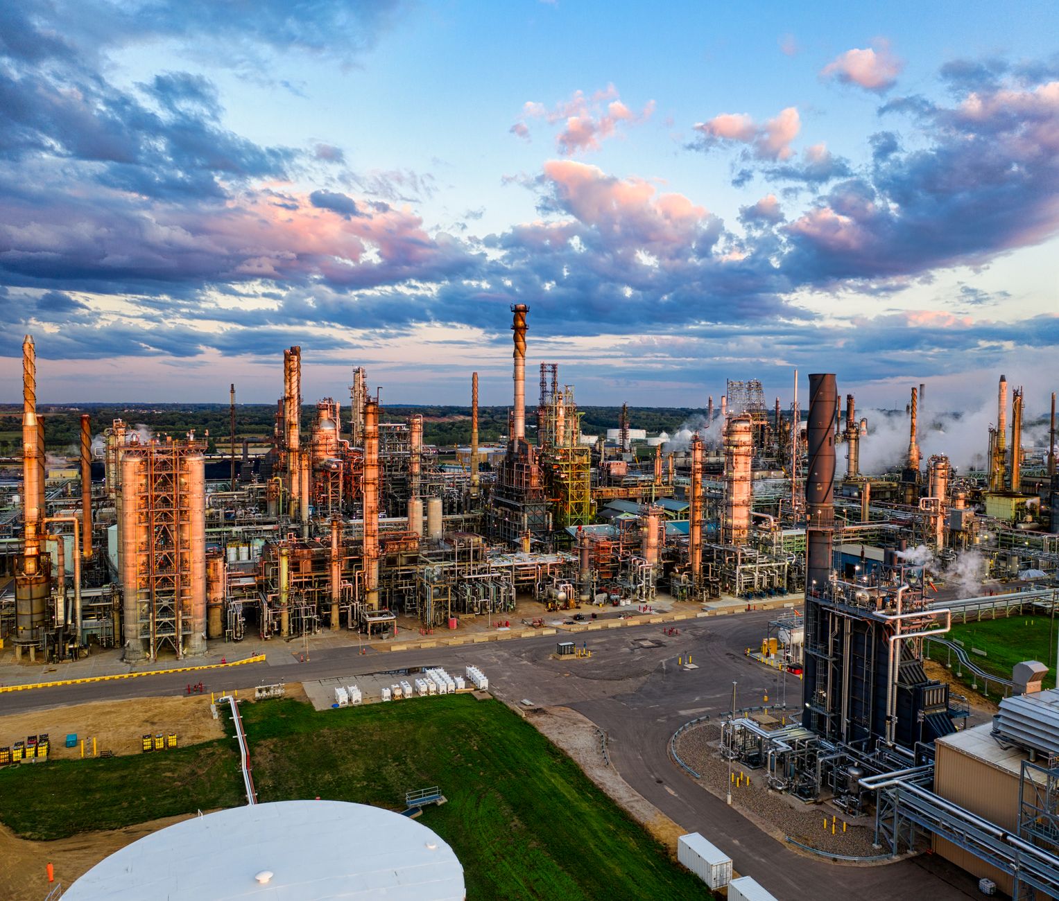Aerial view of oil extraction infrastructure in an open field representing mineral royalty assets
