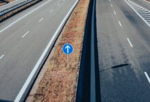 Aerial view of a major highway with multiple lanes of traffic
