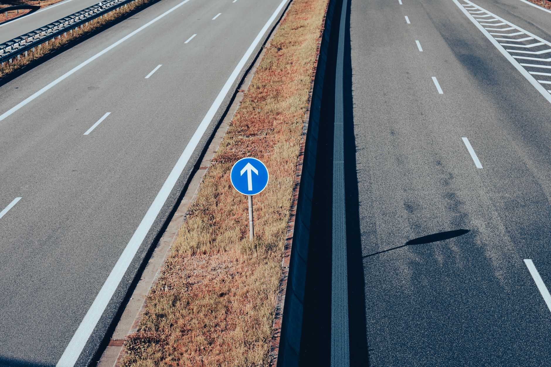 Aerial view of a major highway with multiple lanes of traffic