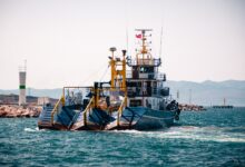 Large dredging vessel operating on the open ocean extracting seabed materials