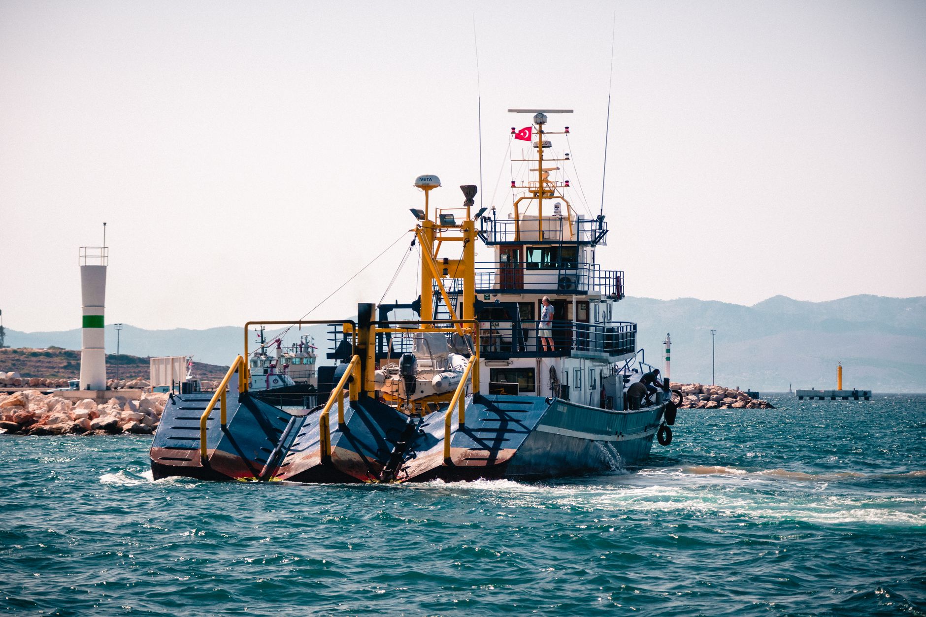 Large dredging vessel operating on the open ocean extracting seabed materials