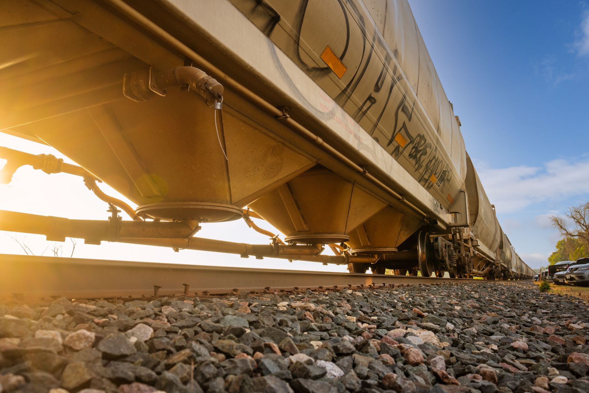 A freight train moving through a rural rail corridor representing easement land rights