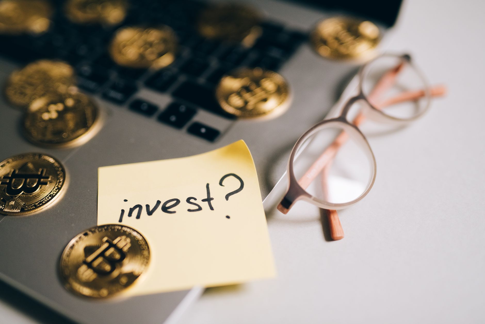 Financial professionals reviewing investment portfolio documents at a desk