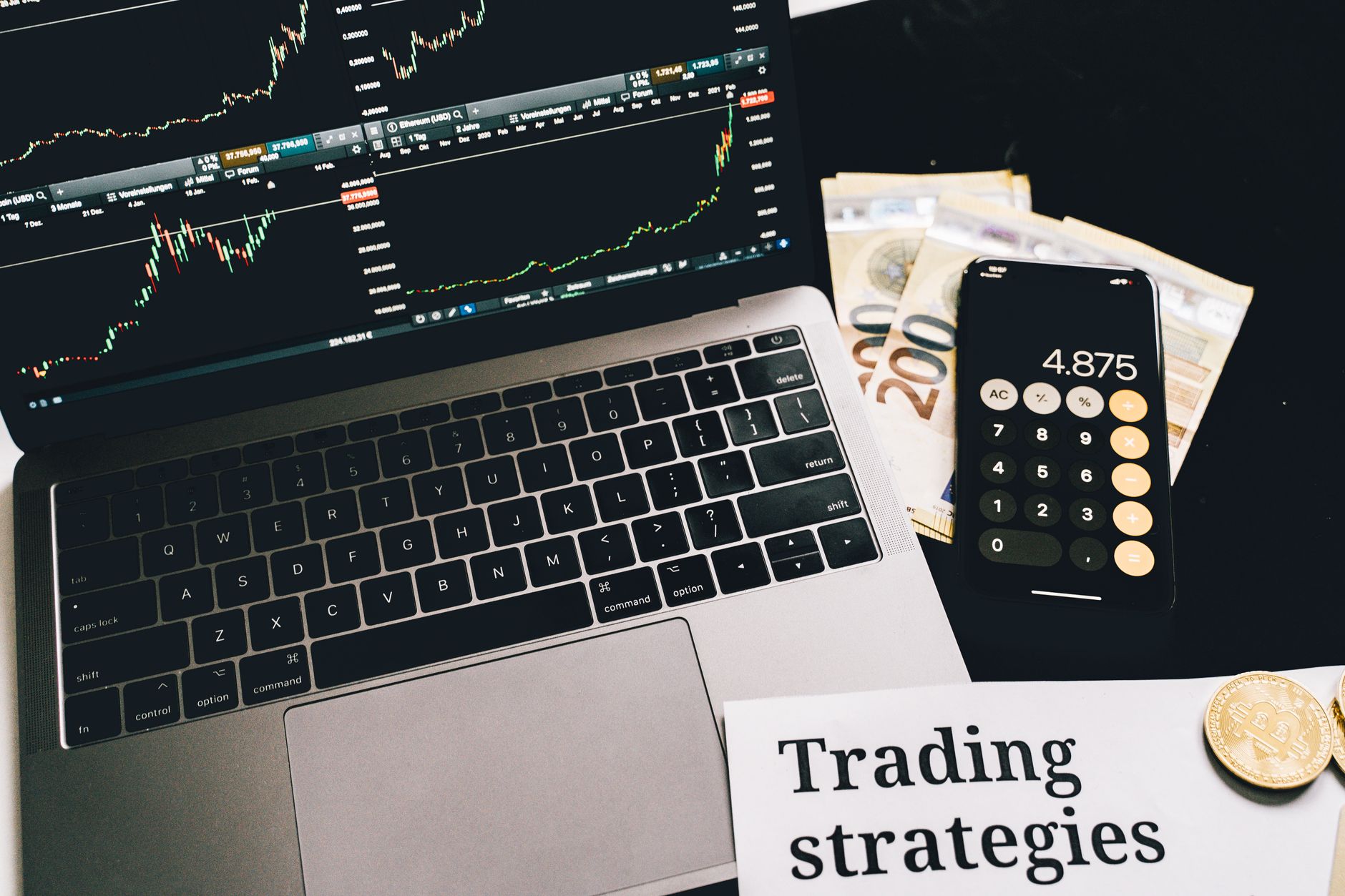 Financial trading screens displaying market data relevant to alternative asset investment strategies