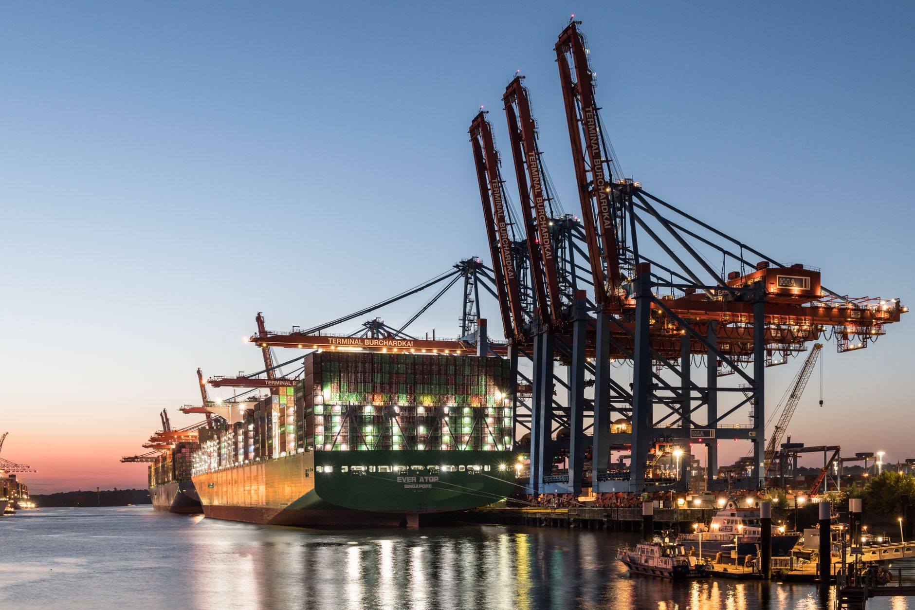 Commercial cargo vessel docked at a bulk liquid export terminal